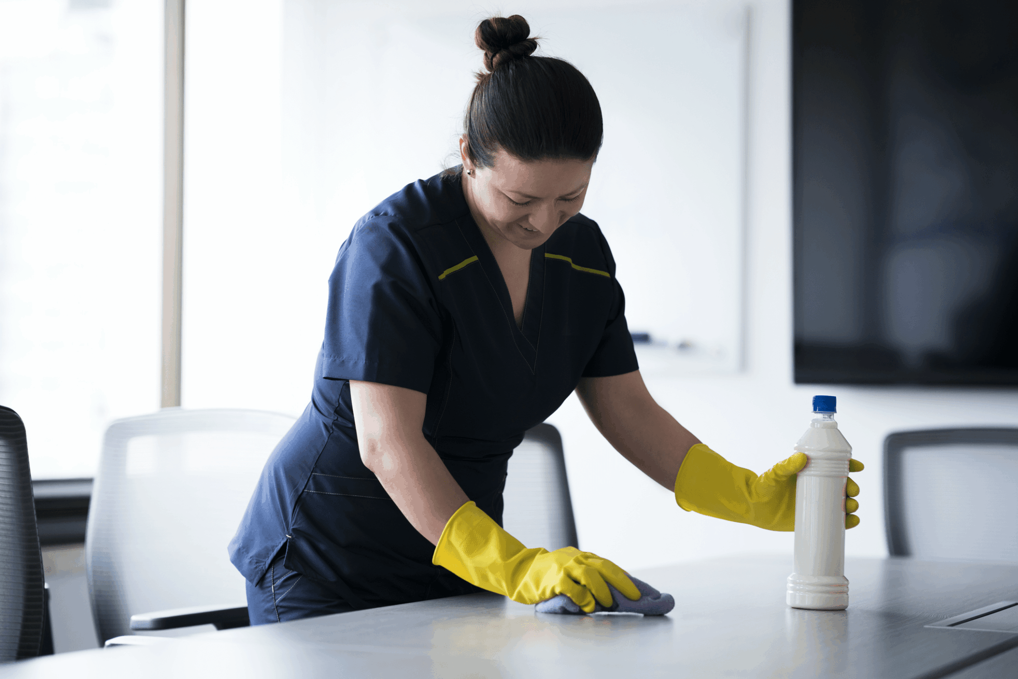 Agent Onet Cleaning and Associated Services disinfecting a table