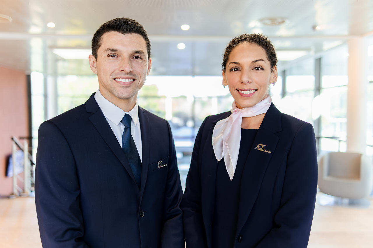 a corporate receptionist and a corporate hostess