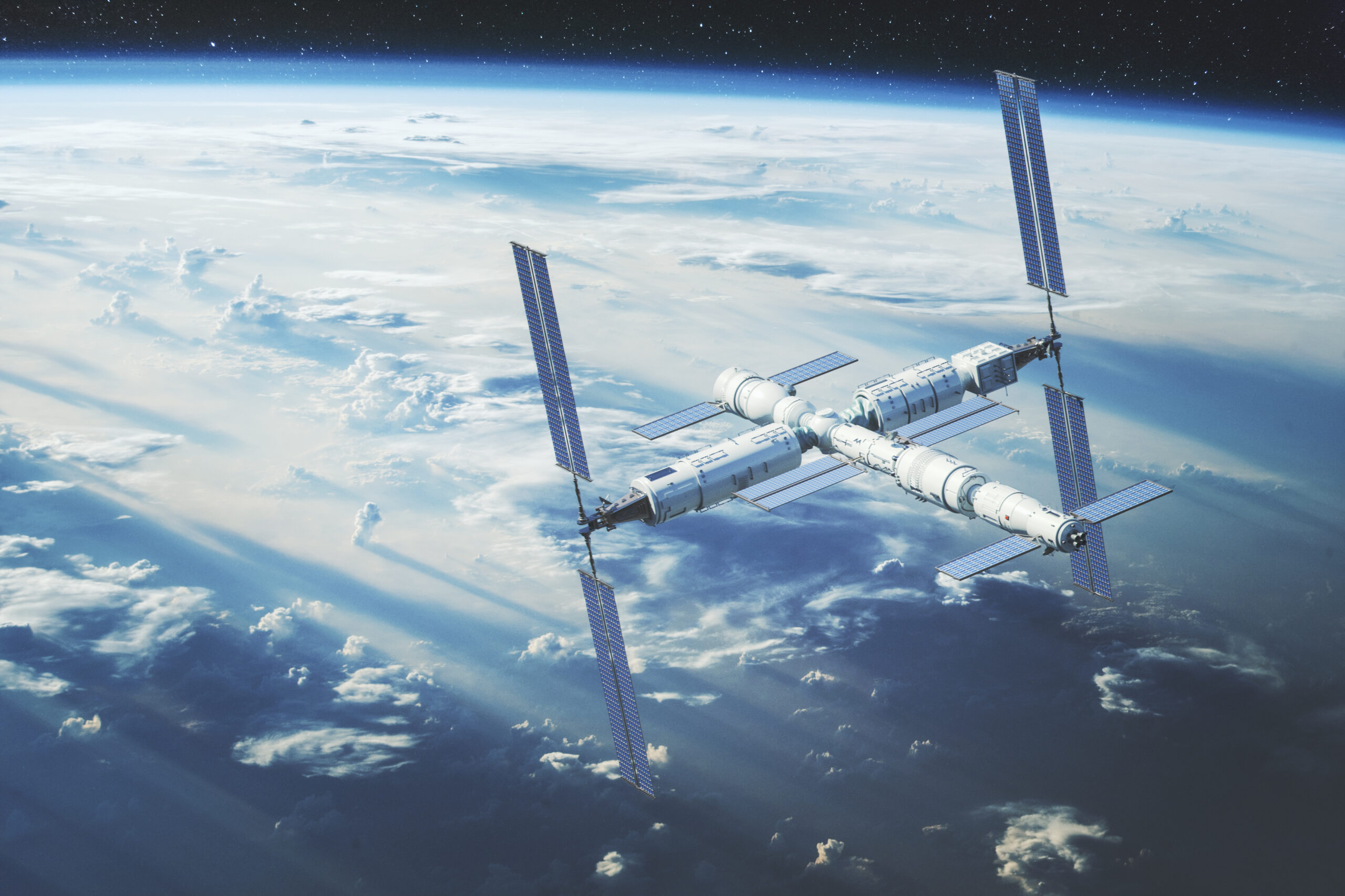 GettyImages-1396504424 Chinese Tianhe core module of the Tiangong space station - flying over the Philippines. This is entirely 3D generated image. Background image is from Nasa - https://www.nasa.gov/image-feature/sunrise-shadows-over-the-philippine-sea. Composited image of the stars is my own shot. Space station module is 3D model.